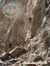 Climber in April on a wet Carlin